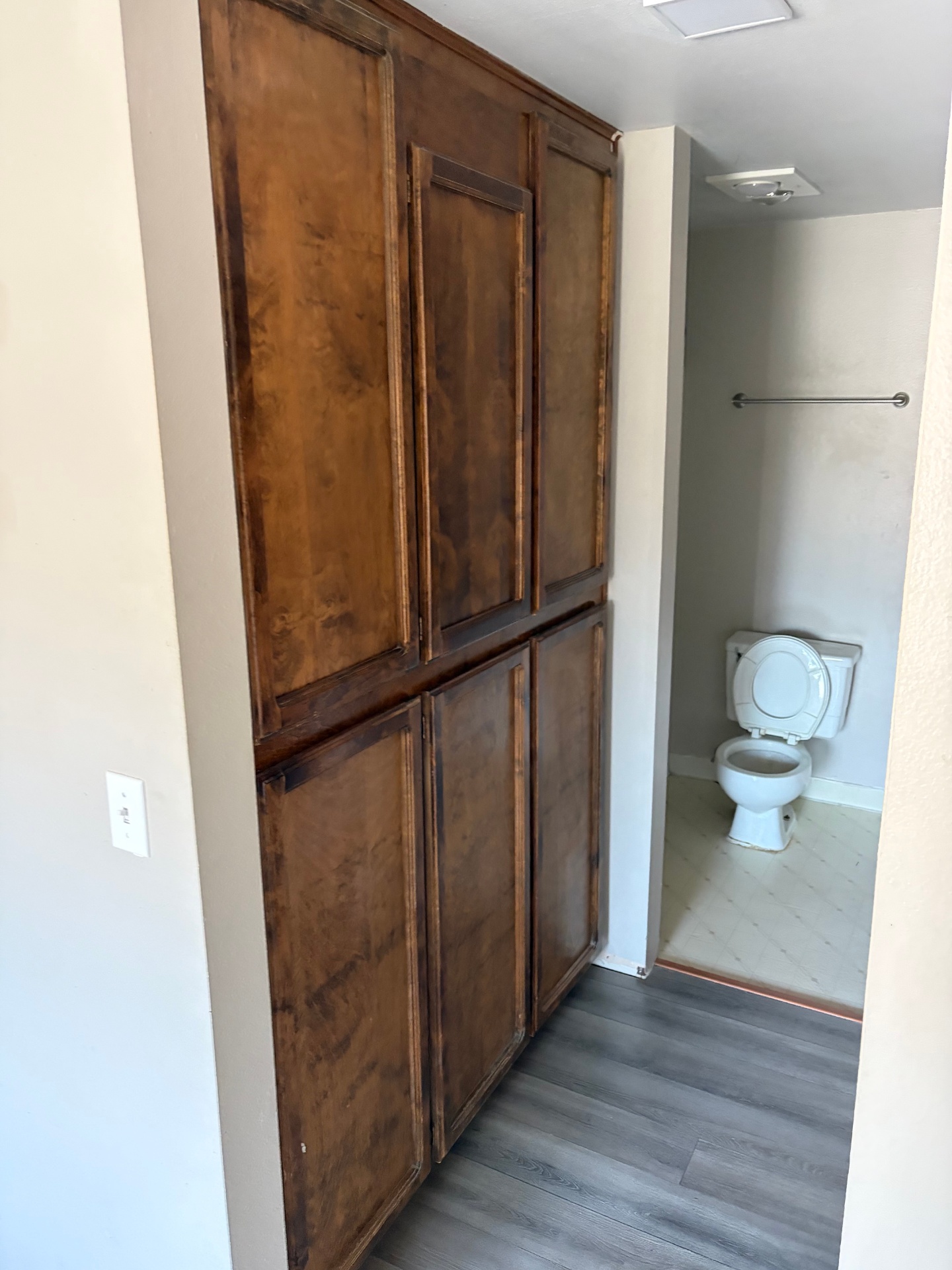 Before: dated stained wood cabinet doors in a Portland Metro condo interior