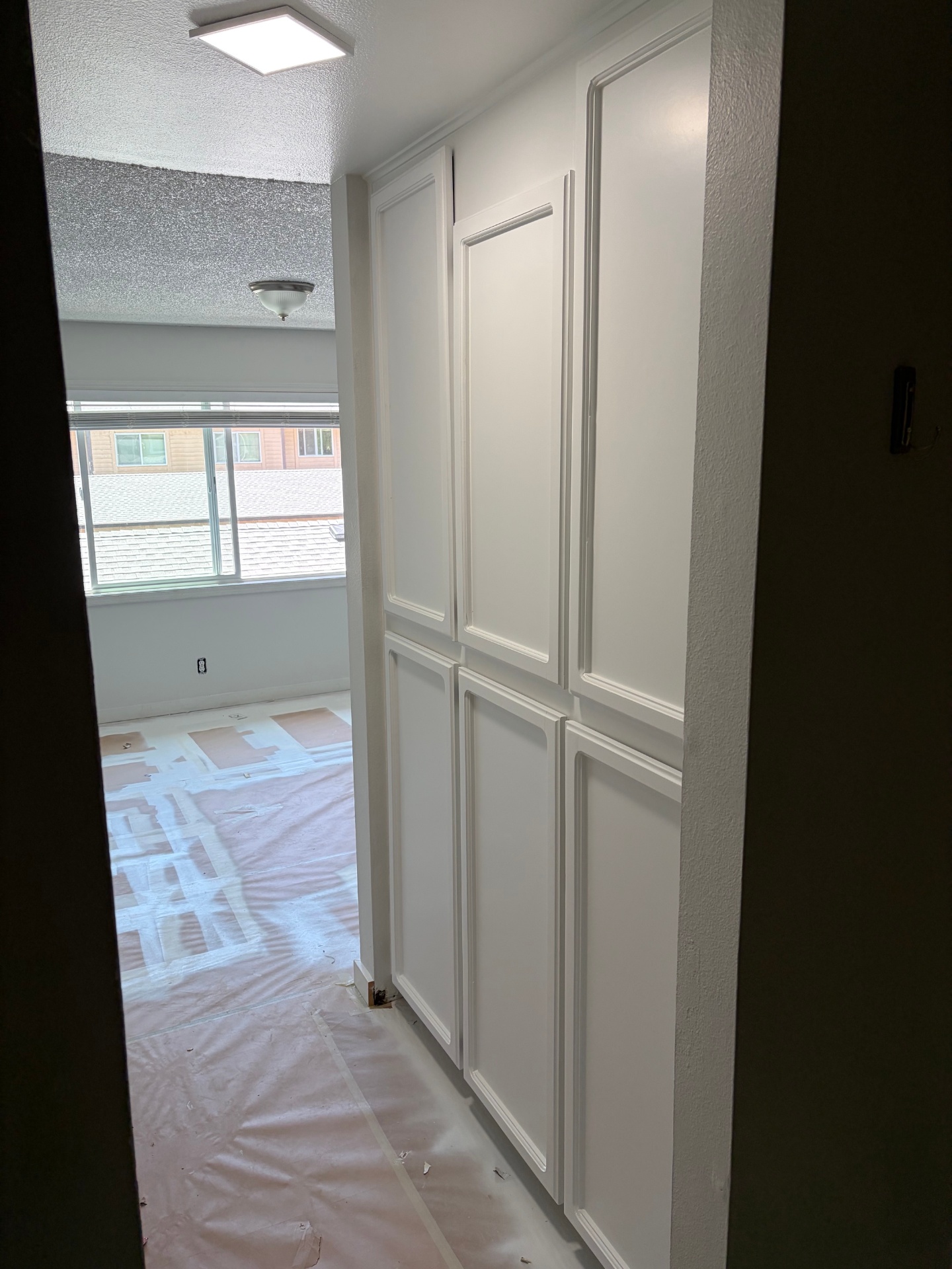 After: bright white enamel cabinet doors after professional interior painting by Image Home Renovations